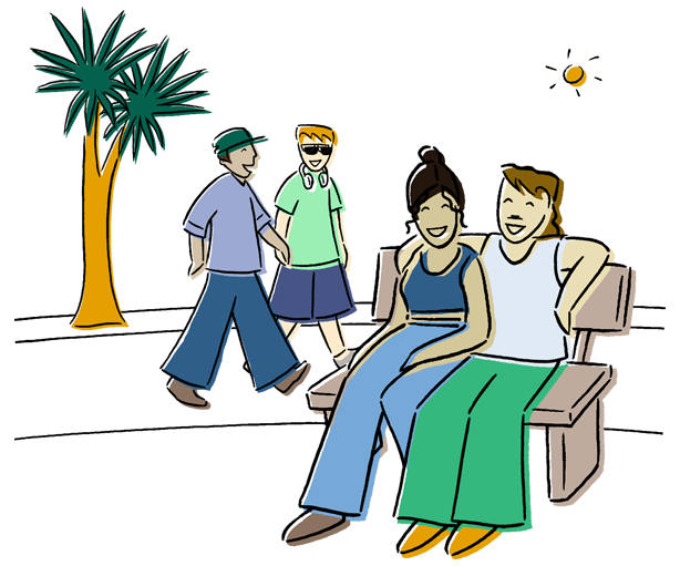 Two smiling people sit outdoors on a bench, behind them are two more people walking by and a tall native tree